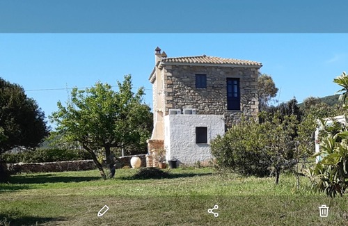 Sassari House | Ideal Retreat: Rustico in Pietra near the Sea with Kids' Amenities