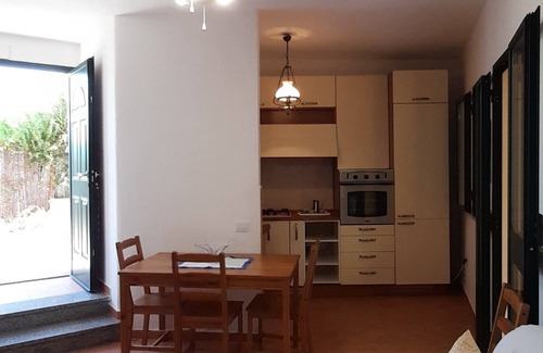 La Caletta Apartment | Sa Calitta Apartment: Oceanfront Retreat Steps from the Beach