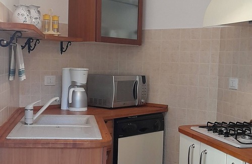 La Caletta Apartment | Sa Calitta Apartment: Oceanfront Retreat Steps from the Beach