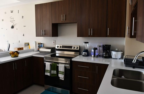New Kingston Apartment | Peaceful Stay with Family-Friendly Amenities & Top Ratings