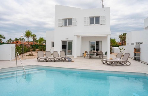 Cap d'Artrutx Apartment | Discover Villas Rymar: Family-Friendly with Pool & Breakfast