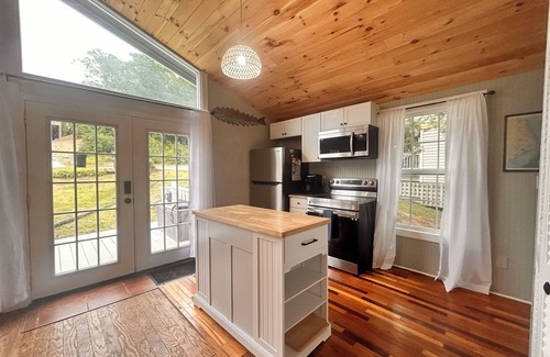 Colington Harbour Cottage | Pet-Friendly Cottage with Pool, Steps from the Sound
