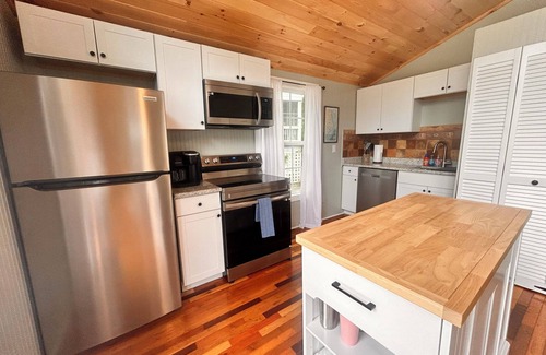 Colington Harbour Cottage | Pet-Friendly Cottage with Pool, Steps from the Sound