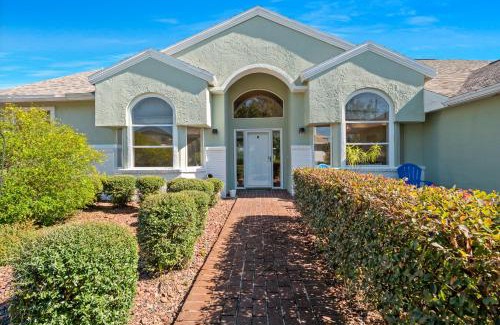 Palm Harbor House | Discover SALTY TURTLE: Poolside Retreat with Tiki Bar