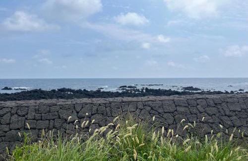 Seongsan House | Oceanfront Retreat at SamDalChae with Hot Tub & Views
