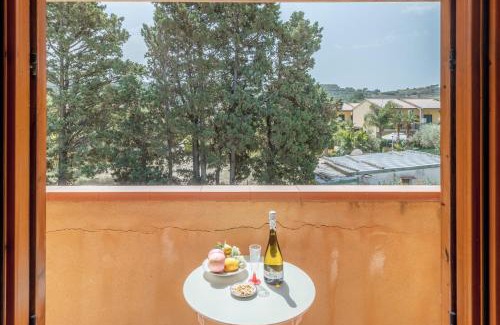 Campofelice di Roccella Apartment | Relax at San Carlo: Private Beach with Ocean View & Family Fun