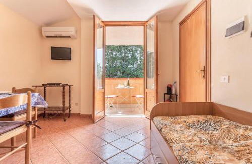 Campofelice di Roccella Apartment | Relax at San Carlo: Private Beach with Ocean View & Family Fun