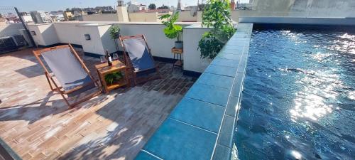 San Julian Apartment | Ideal San Luis Downtown & Pool Apartment with Ocean Views