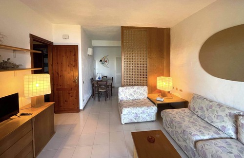 Capo Coda Cavallo Apartment | Idyllic San Teodoro Punta Est: Garden & Sea View Retreat