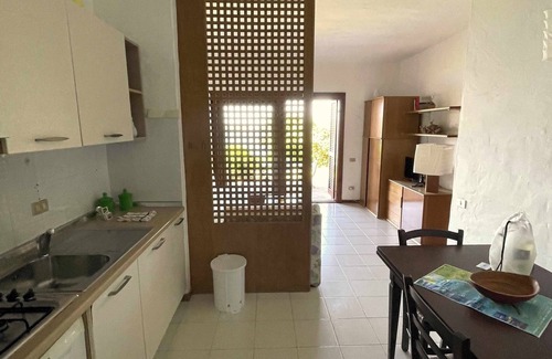 Capo Coda Cavallo Apartment | Idyllic San Teodoro Punta Est: Garden & Sea View Retreat
