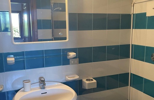 Capo Coda Cavallo Apartment | Idyllic San Teodoro Punta Est: Garden & Sea View Retreat