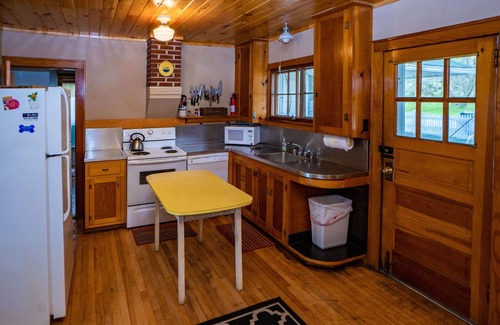 Alden House | Idyllic Sandy Beach Cottage on Torch Lake with Ocean Views