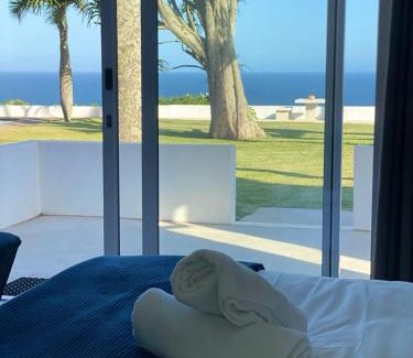 Amanzimtoti House | Charming Santorini Guesthouse with Oceanfront Views
