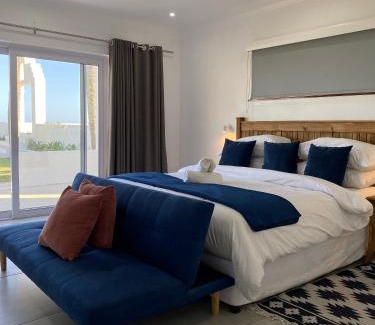 Amanzimtoti House | Charming Santorini Guesthouse with Oceanfront Views