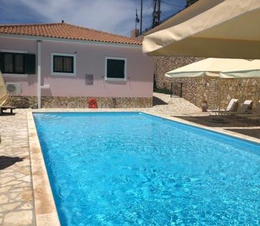 Sarlata Apartment | Experience Tranquility at Sarantos Pool Suites with Ocean View