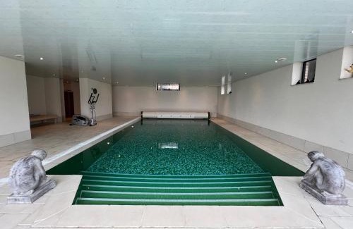 Theux Apartment | Discover Sassor Village: Oceanfront Retreat with Pool Access