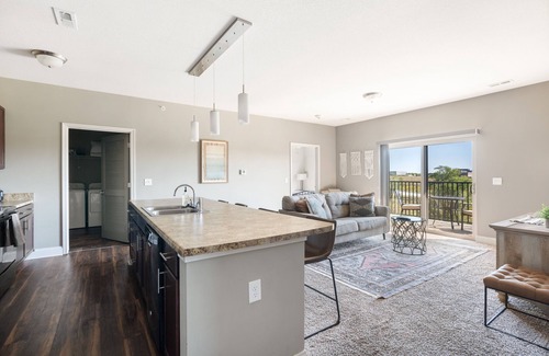 West Des Moines Apartment | Serene Forest Escape with Garage & Family-Friendly Amenities