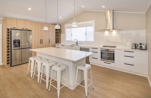 Broadwater House | Beachside Family Haven with Ocean View & Pool Access