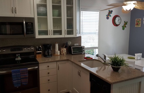 Truman Annex Cottage | Elegant Sea Breeze Cottage with Ocean Views & 2 Decks