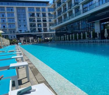 Baku Apartment | Relax at Sea Breeze Lighthouse with Pool & Family Fun