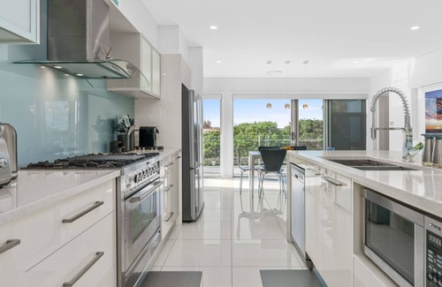 Culburra Beach House | Sea La Vie: Pet Friendly Retreat with Pool and Spa Access