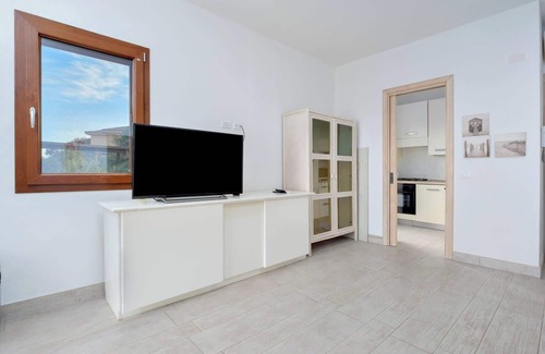 Baia Caddinas Apartment | Oceanfront Retreat: Steps from a Pristine Beach