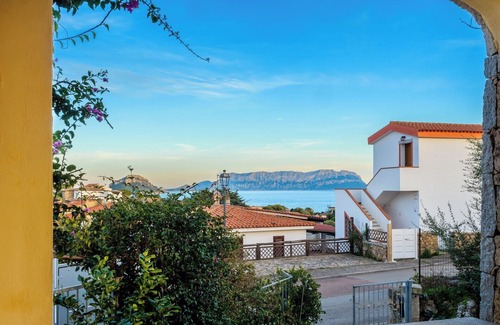 Baia Caddinas Apartment | Oceanfront Retreat: Steps from a Pristine Beach