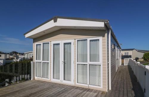 Rhyd-y-clafdy House | Seafront Holiday Home 2 - Family-Friendly with Pool