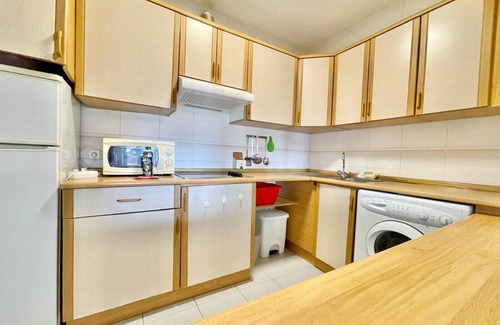 Cala Apartment | Seafront Poniente Beach Retreat with Spa & Family Amenities
