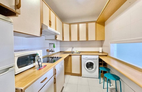 Cala Apartment | Seafront Poniente Beach Retreat with Spa & Family Amenities