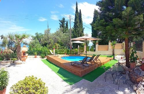 Agia Pelagia Chlomou Apartment | Beautiful Seaside Pool Villa with Oceanfront Views