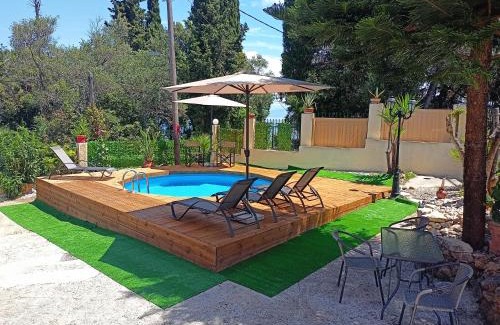 Agia Pelagia Chlomou Apartment | Beautiful Seaside Pool Villa with Oceanfront Views