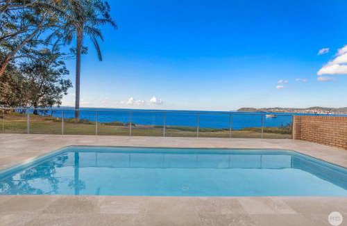 Salamander Bay House | Waterfront Haven: Family-Friendly Home with Heated Pool