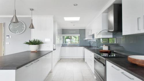 Salamander Bay House | Waterfront Haven: Family-Friendly Home with Heated Pool