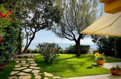 Bonifati House | Seaside Villa: Oceanfront Escape with Private Garden