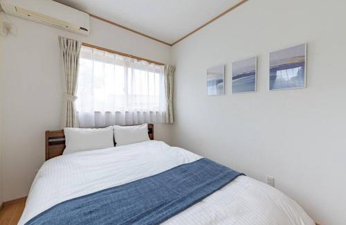 Maizuru Apartment | Beachfront Getaway at Seaside Villa Nagi - Family Friendly