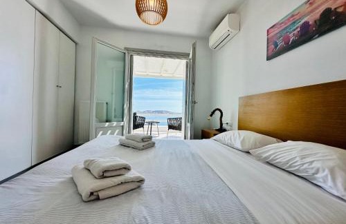Agios Stefanos Apartment | Indulgent Seaview Residence with Hot Tub for Families