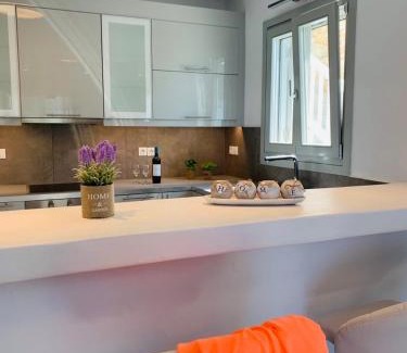 Agios Stefanos Apartment | Indulgent Seaview Residence with Hot Tub for Families