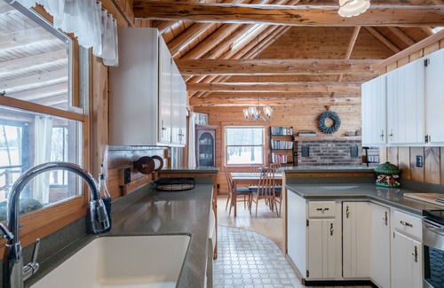 Big Rapids Cottage | Tranquil Lakefront Log Home with Sauna and Scenic Views