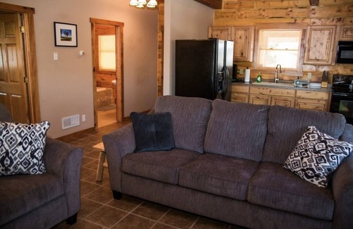 Hazel Green Cabin | Tranquil Log Cabin Retreat with Hot Tub & Pet-Friendly Perks
