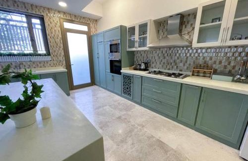 Dhahran Ski Chalet | Discover Secret Beach Resort with Private Ocean View