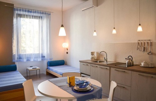 Riva del Garda Apartment | Discover Sembenini Palace: Pet-Friendly and Family-Ready