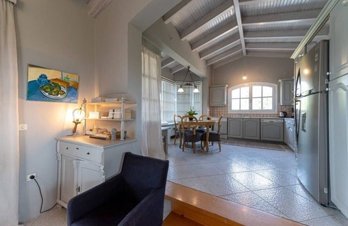 Kalamata House | Oceanfront Oasis: Lush Garden Retreat with Unmatched Views