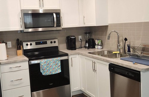 Southeast Calgary House | Cozy Seton Suite: Child Friendly with Kitchen Amenities