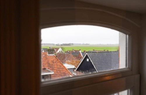 Eenrum Apartment | Unique Stay in Historic Town Hall of Eenrum - Family Friendly