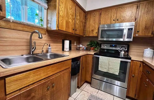 Burnet House | Shaded riverfront getaway. Dog friendly