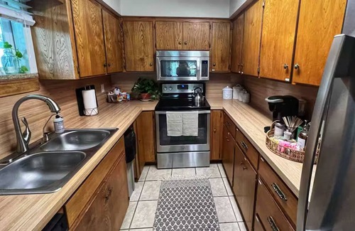 Burnet House | Shaded riverfront getaway. Dog friendly
