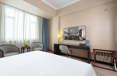 Baoshan Hotel | Discover Comfort at Shanghai Gongkang Meilun Hotel