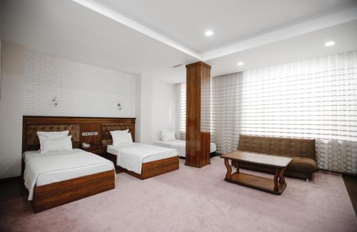 Namangan Hotel | Discover Shedevr Plaza: Poolside Retreat for Families