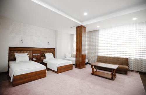 Namangan Hotel | Discover Shedevr Plaza: Poolside Retreat for Families